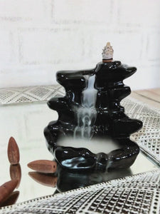 Waterfall Backflow burner. Mesmerizing is the only way to describe these stunning Back-flow burners. At first glance it seems as if there is misty water flowing down a mysterious waterfall. This ceramic Back-flow Waterfall Burner will have you lost in its awe and beauty while tantalizing your senses with a wide variety of scents.