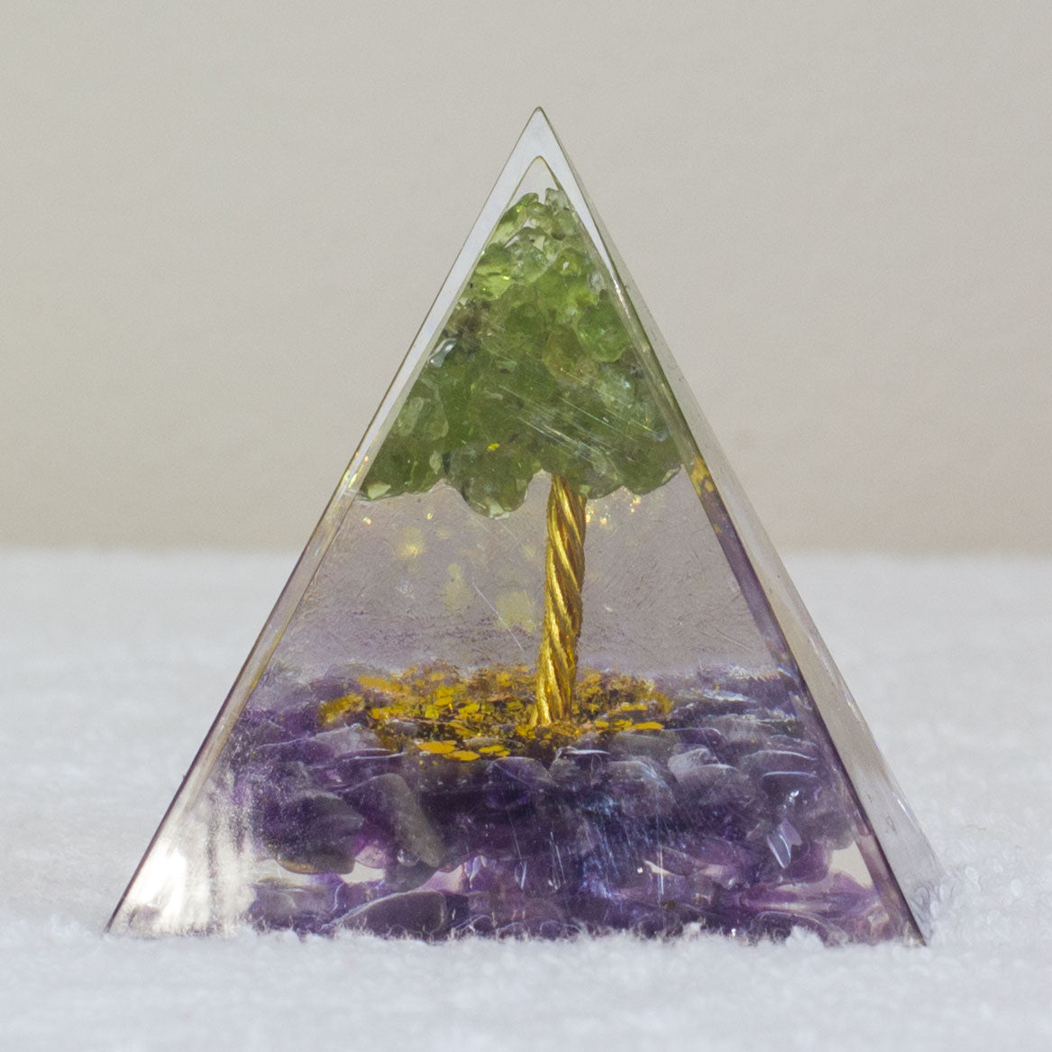 By tapping into the cosmic universal energy with a mix of quartz crystals, semi-precious gemstones, metals, and resin, you can balance out the life energy that surrounds you. Any negative vibes and energy that affect your body and mind can be removed by using an orgonite pyramid in your home. These healing crystals are made of metal shavings, resin, and gemstones, which balance electromagnetic fields and promote positive energy.