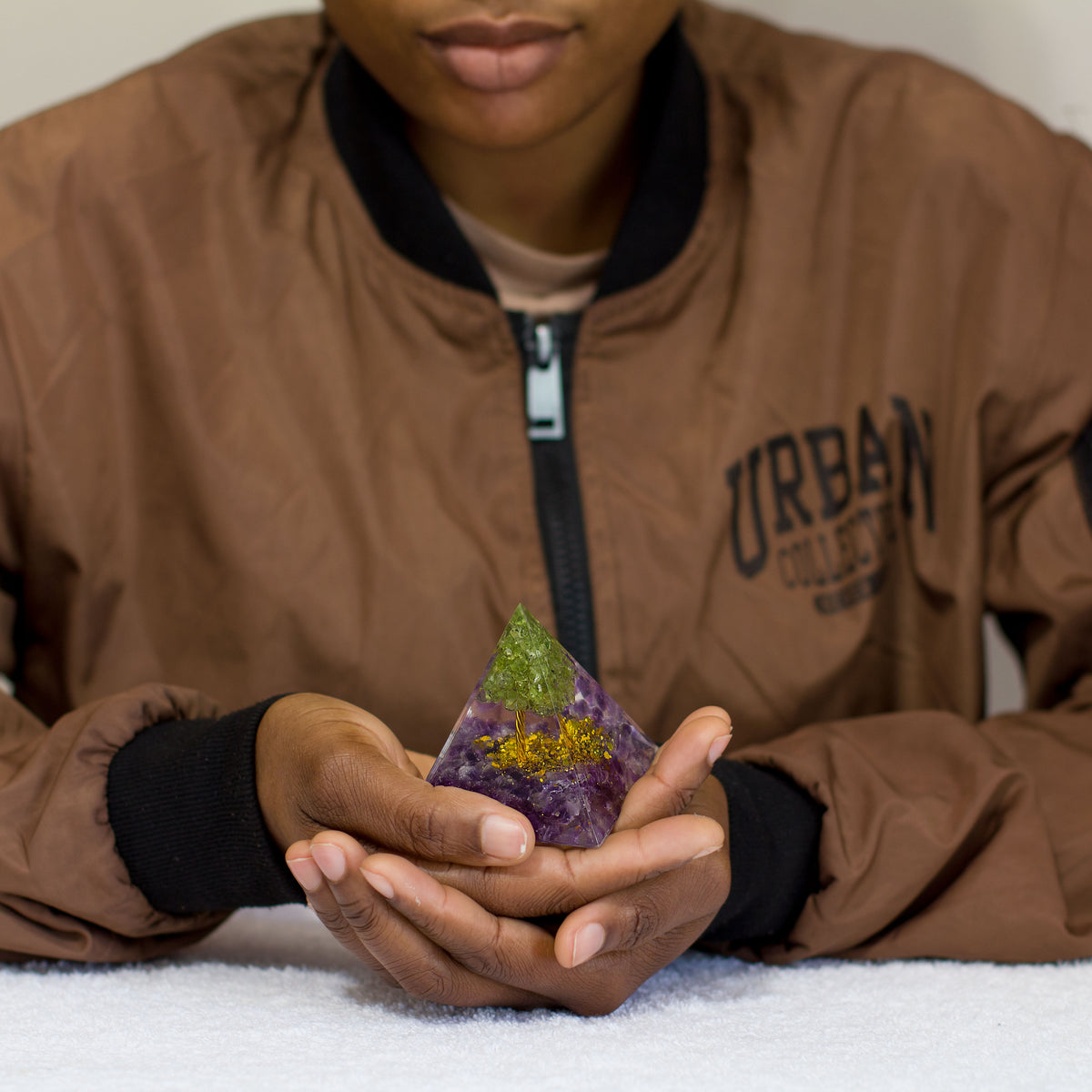 By tapping into the cosmic universal energy with a mix of quartz crystals, semi-precious gemstones, metals, and resin, you can balance out the life energy that surrounds you. Any negative vibes and energy that affect your body and mind can be removed by using an orgonite pyramid in your home. These healing crystals are made of metal shavings, resin, and gemstones, which balance electromagnetic fields and promote positive energy.