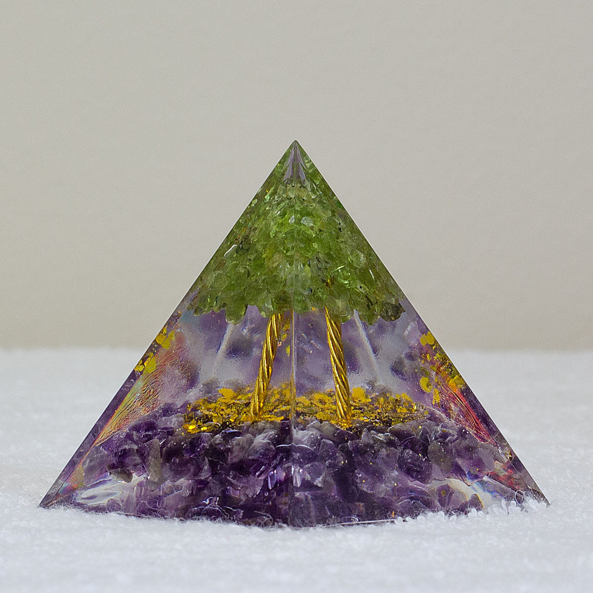 By tapping into the cosmic universal energy with a mix of quartz crystals, semi-precious gemstones, metals, and resin, you can balance out the life energy that surrounds you. Any negative vibes and energy that affect your body and mind can be removed by using an orgonite pyramid in your home. These healing crystals are made of metal shavings, resin, and gemstones, which balance electromagnetic fields and promote positive energy.