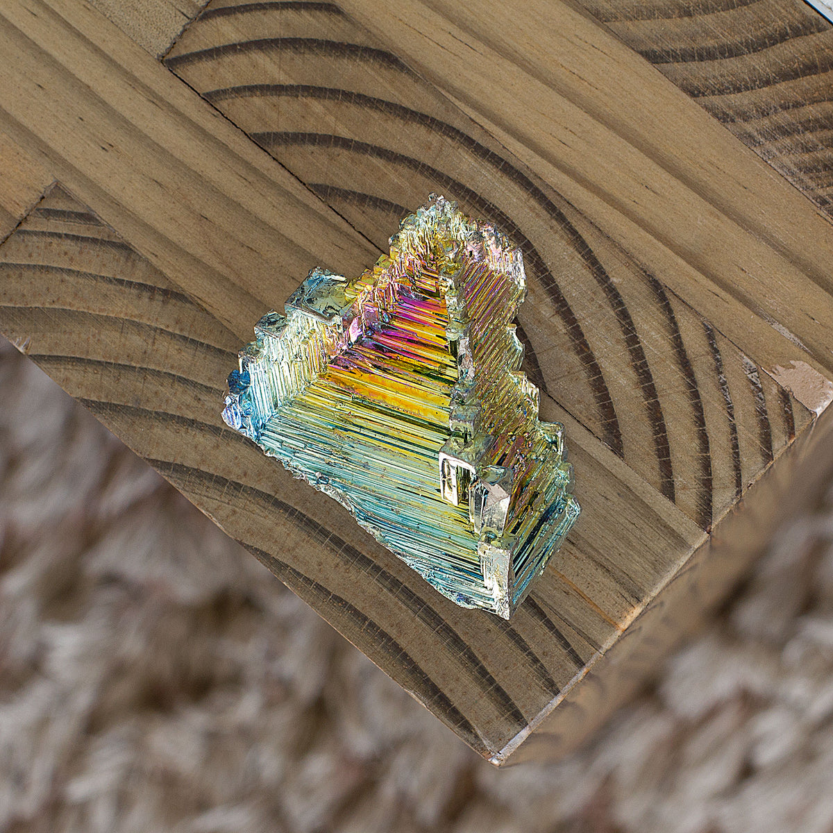 Bismuth is believed to boost energy, vitality, and help achieve goals, especially when working with a team. It is said to aid in transformation by connecting the physical realm with the astral and spiritual planes. Additionally, it is thought to improve visualization during shamanic journeys. Lastly, it is believed to ease feelings of being overwhelmed, isolated, and lonely. Bismuth is often confused with tin and lead, but it is its own element, number 83 on the periodic table. In its natural form, it is a 