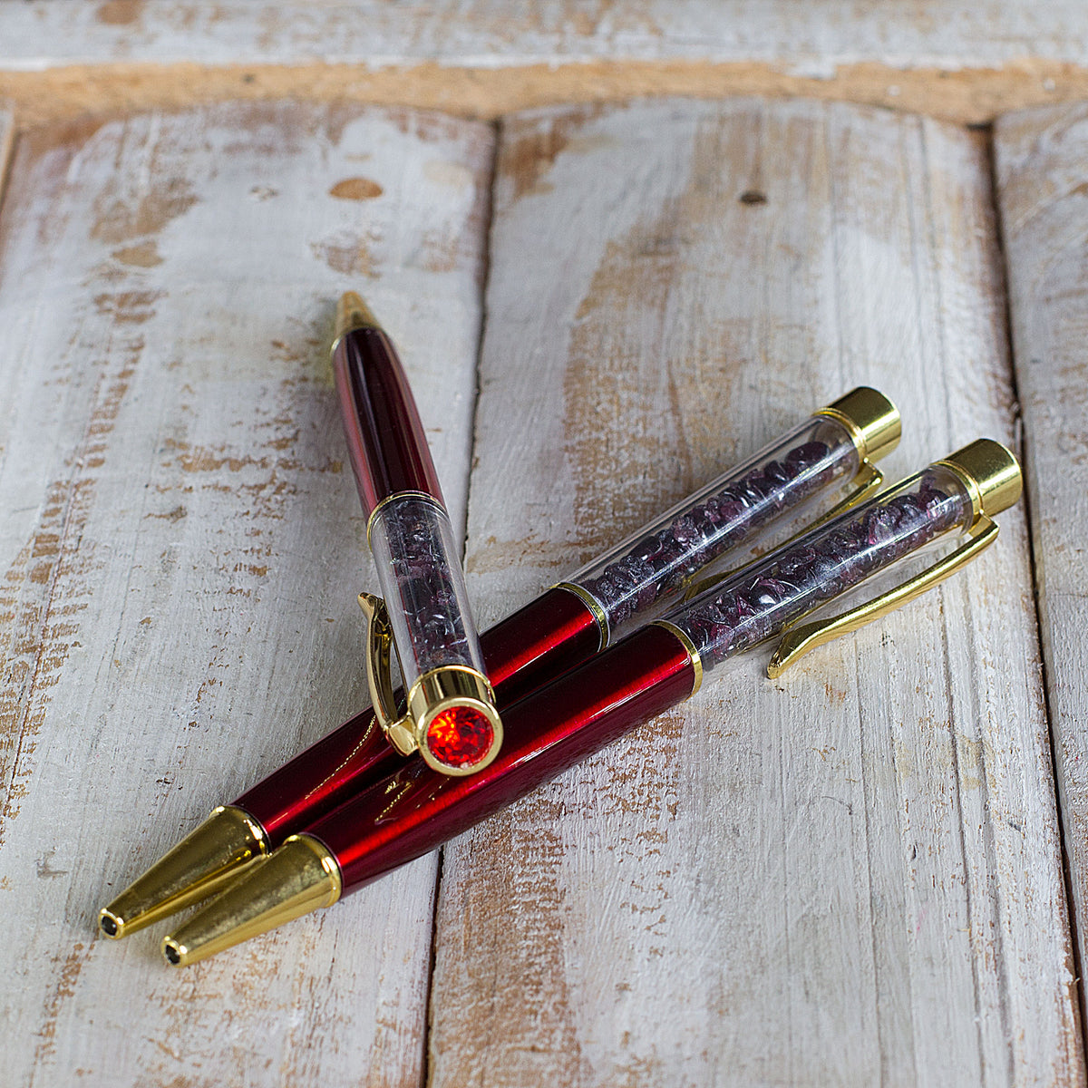 Crystal Pen - Get ready to elevate your writing experience with our meticulously crafted crystal gemstone ballpoint pens. These exquisite pens are designed with precision and attention to detail, featuring stunning crystal chips encased within a transparent cylinder. Each pen is a work of art, showcasing the natural beauty of the crystals. The reflective facets of the crystals catch the light, creating a mesmerizing display that is sure to captivate.