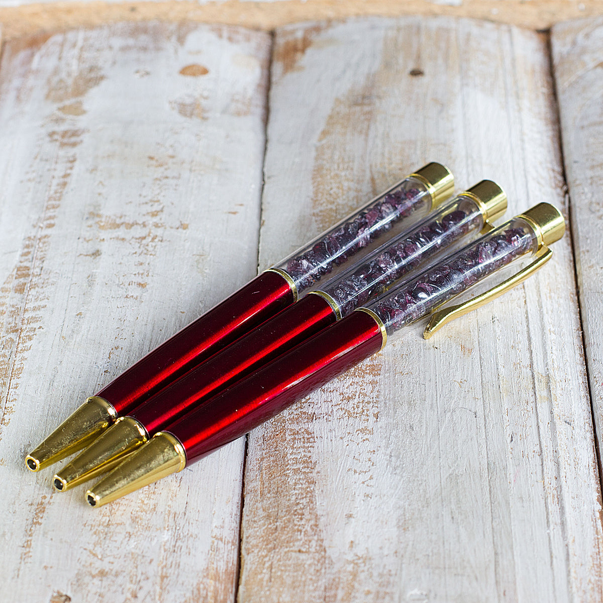 Crystal Pen - Get ready to elevate your writing experience with our meticulously crafted crystal gemstone ballpoint pens. These exquisite pens are designed with precision and attention to detail, featuring stunning crystal chips encased within a transparent cylinder. Each pen is a work of art, showcasing the natural beauty of the crystals. The reflective facets of the crystals catch the light, creating a mesmerizing display that is sure to captivate.