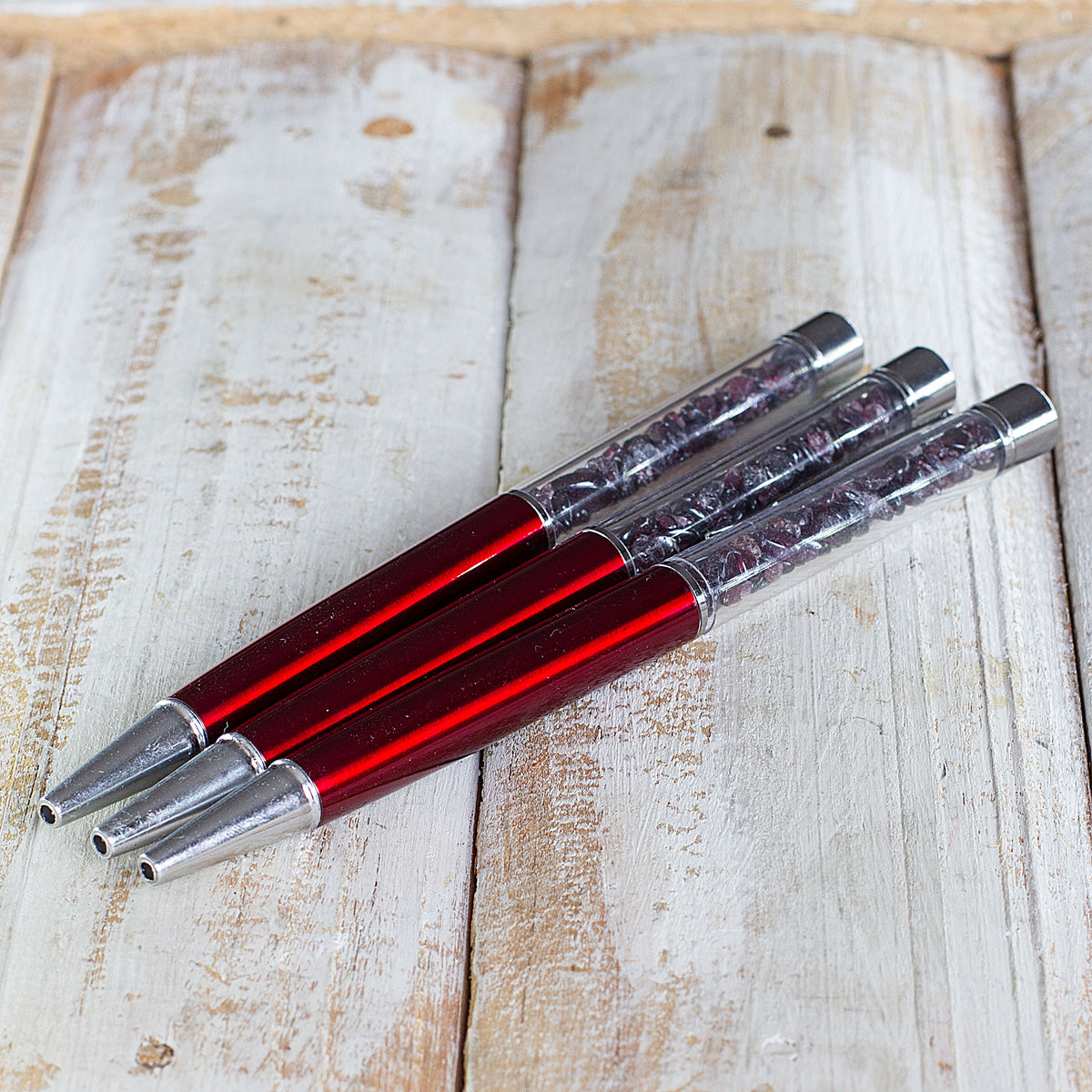 Crystal Pen - Get ready to elevate your writing experience with our meticulously crafted crystal gemstone ballpoint pens. These exquisite pens are designed with precision and attention to detail, featuring stunning crystal chips encased within a transparent cylinder. Each pen is a work of art, showcasing the natural beauty of the crystals. The reflective facets of the crystals catch the light, creating a mesmerizing display that is sure to captivate.