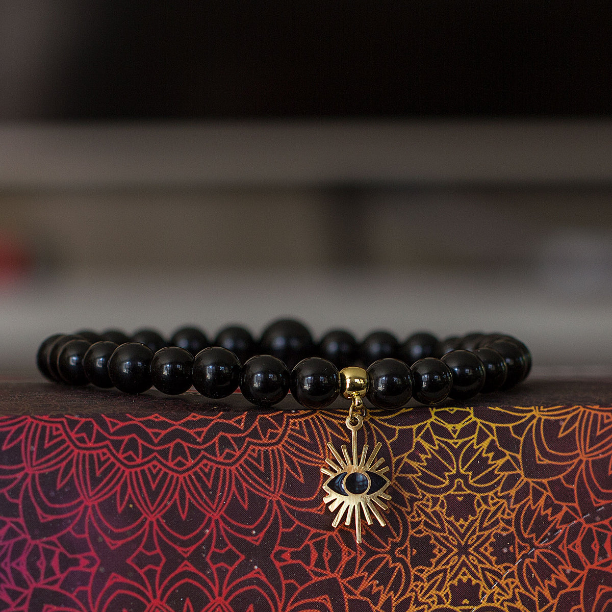Evil Eye Black Obsidian Bracelet - Rabbi Abraham Isaac Kook explained that the &quot;evil eye&quot; is an example of how one soul can affect another through unseen connections between them. We are all influenced by our environment. The evil eye represents the venomous impact from malignant feelings of jealousy and envy of those around us. It is the belief that someone can have power over you or cause you harm, and wearing an evil eye talisman can be a way to protect yourself.