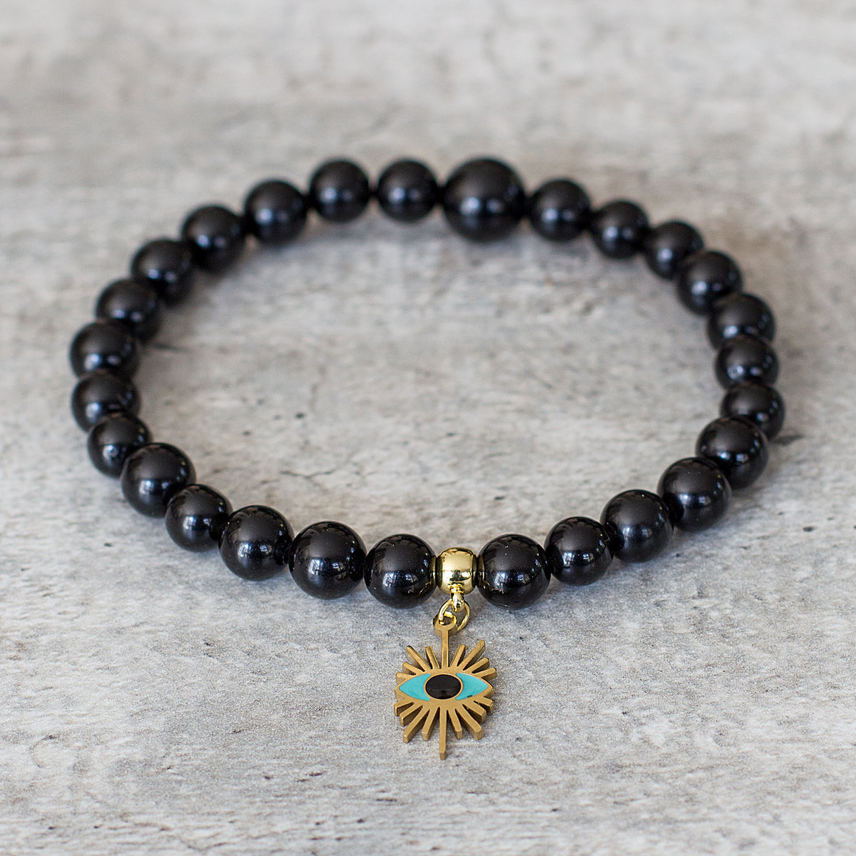Evil Eye Black Obsidian Bracelet - Rabbi Abraham Isaac Kook explained that the &quot;evil eye&quot; is an example of how one soul can affect another through unseen connections between them. We are all influenced by our environment. The evil eye represents the venomous impact from malignant feelings of jealousy and envy of those around us. It is the belief that someone can have power over you or cause you harm, and wearing an evil eye talisman can be a way to protect yourself.