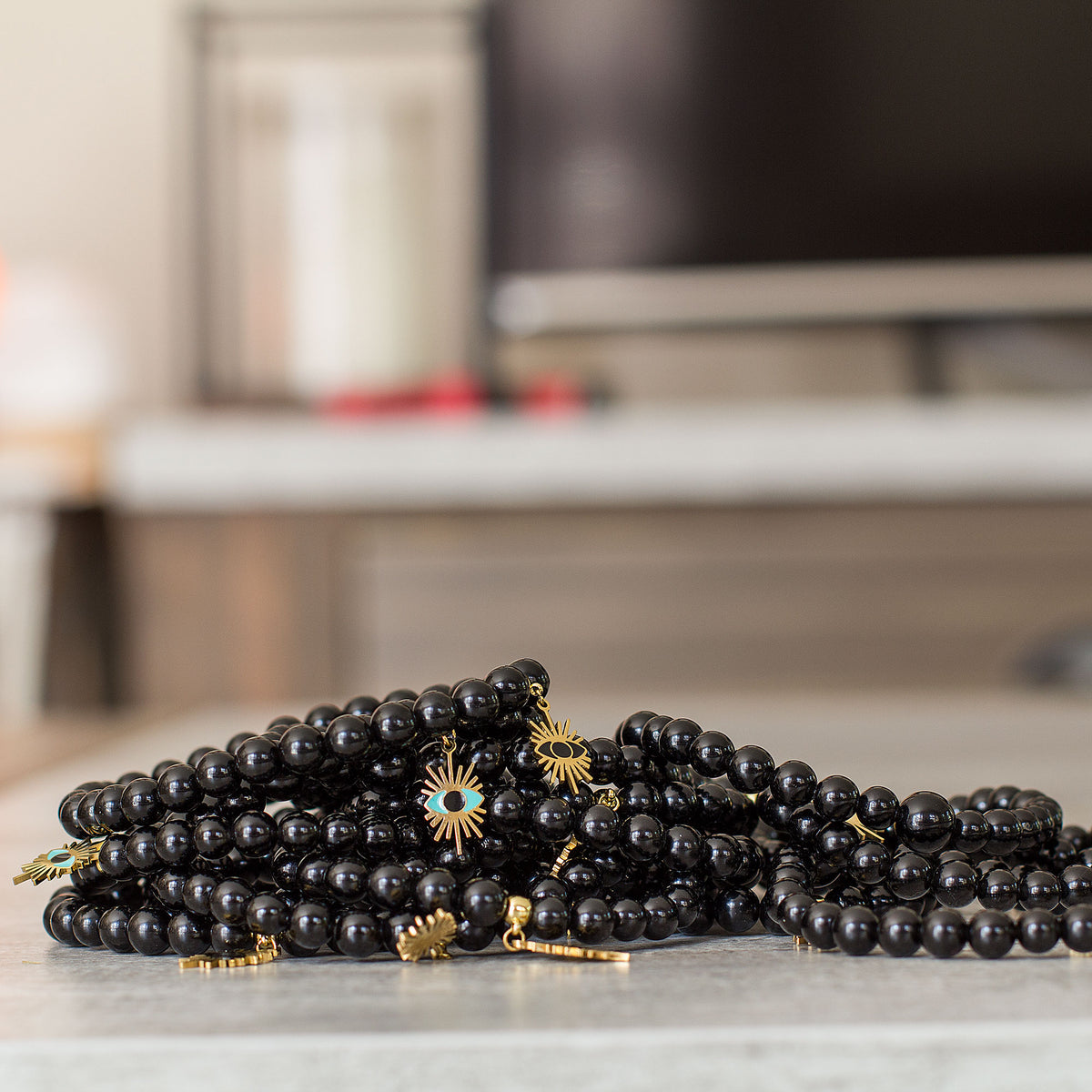 Evil Eye Black Obsidian Bracelet - Rabbi Abraham Isaac Kook explained that the &quot;evil eye&quot; is an example of how one soul can affect another through unseen connections between them. We are all influenced by our environment. The evil eye represents the venomous impact from malignant feelings of jealousy and envy of those around us. It is the belief that someone can have power over you or cause you harm, and wearing an evil eye talisman can be a way to protect yourself.