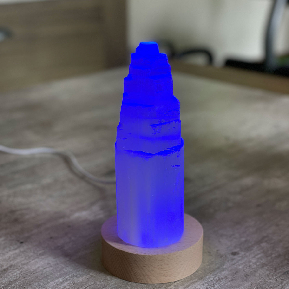 Selenite Lamp - Tower Large - Selenite is a beautiful and versatile crystal that offers numerous benefits, making it a popular choice for both decor and holistic purposes. Its natural beauty and unique translucent appearance make it an eye-catching addition to any home. Selenite emits a soft and warm glow, which makes it an excellent choice for a night light.