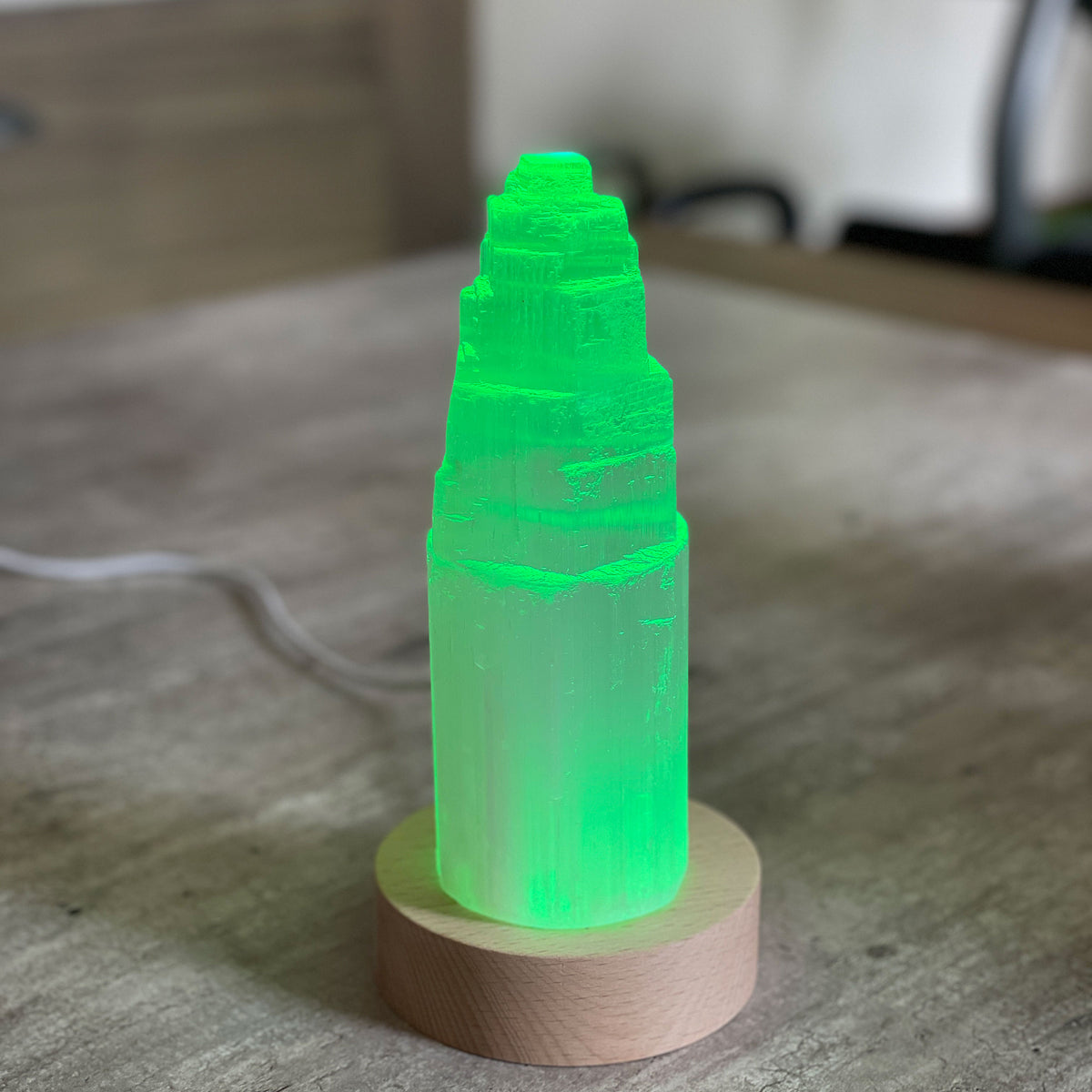 Selenite Lamp - Tower Small - Selenite is a beautiful and versatile crystal that offers numerous benefits, making it a popular choice for both decor and holistic purposes. Its natural beauty and unique translucent appearance make it an eye-catching addition to any home. Selenite emits a soft and warm glow, which makes it an excellent choice for a night light.