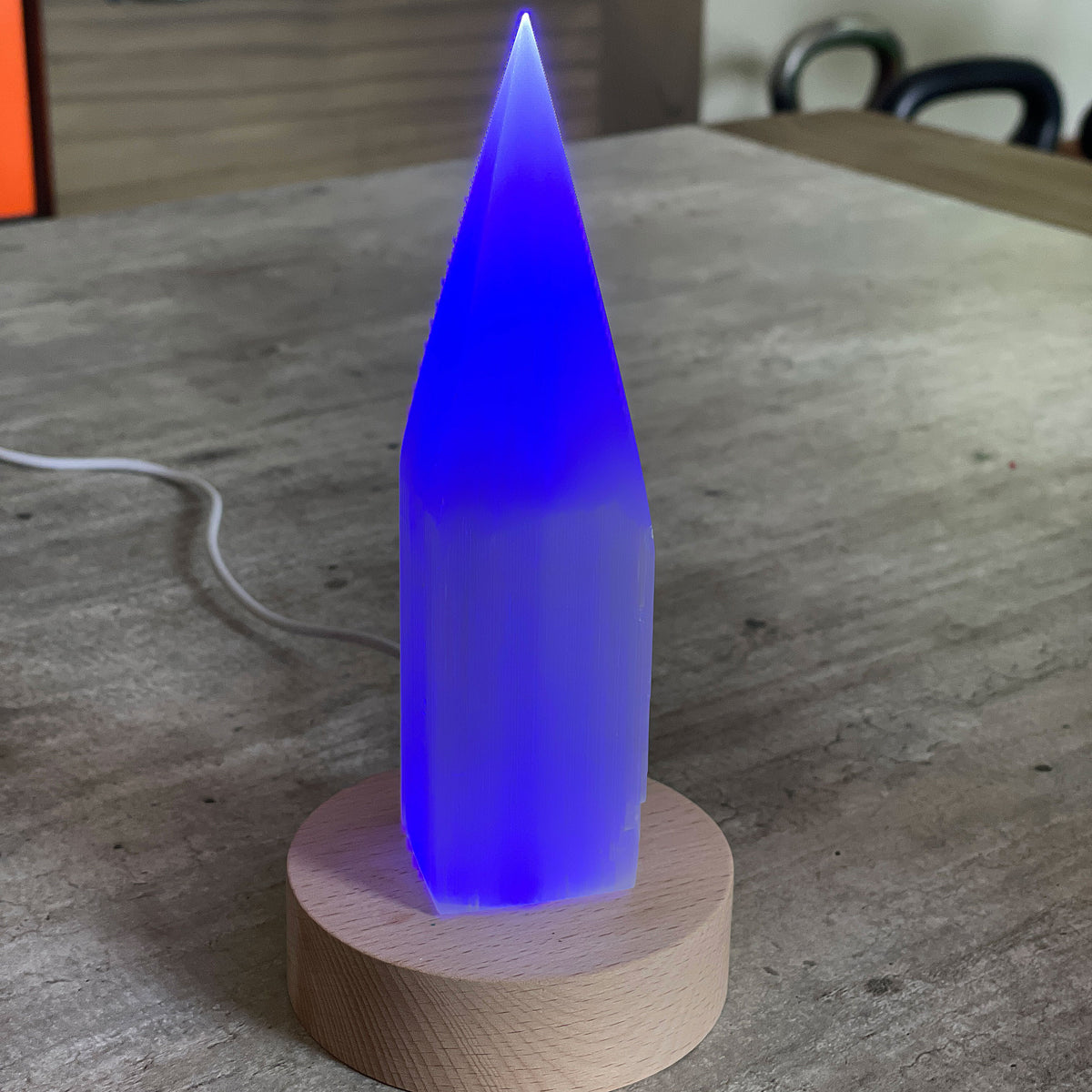 Selenite Lamp - Pencil Point Small - Selenite is a beautiful and versatile crystal that offers numerous benefits, making it a popular choice for both decor and holistic purposes. Its natural beauty and unique translucent appearance make it an eye-catching addition to any home. Selenite emits a soft and warm glow, which makes it an excellent choice for a night light.
