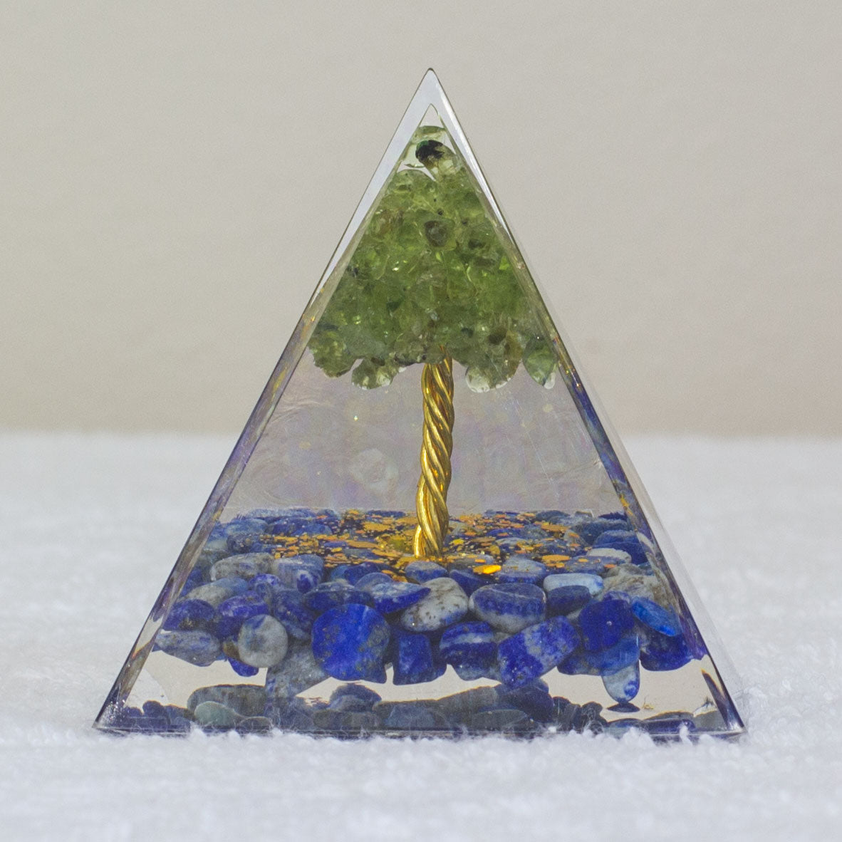 By tapping into the cosmic universal energy with a mix of quartz crystals, semi-precious gemstones, metals, and resin, you can balance out the life energy that surrounds you. Any negative vibes and energy that affect your body and mind can be removed by using an orgonite pyramid in your home. These healing crystals are made of metal shavings, resin, and gemstones, which balance electromagnetic fields and promote positive energy.