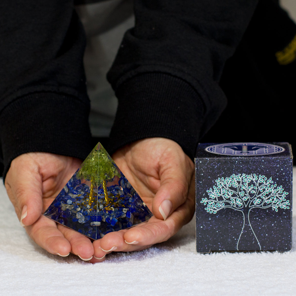 By tapping into the cosmic universal energy with a mix of quartz crystals, semi-precious gemstones, metals, and resin, you can balance out the life energy that surrounds you. Any negative vibes and energy that affect your body and mind can be removed by using an orgonite pyramid in your home. These healing crystals are made of metal shavings, resin, and gemstones, which balance electromagnetic fields and promote positive energy.