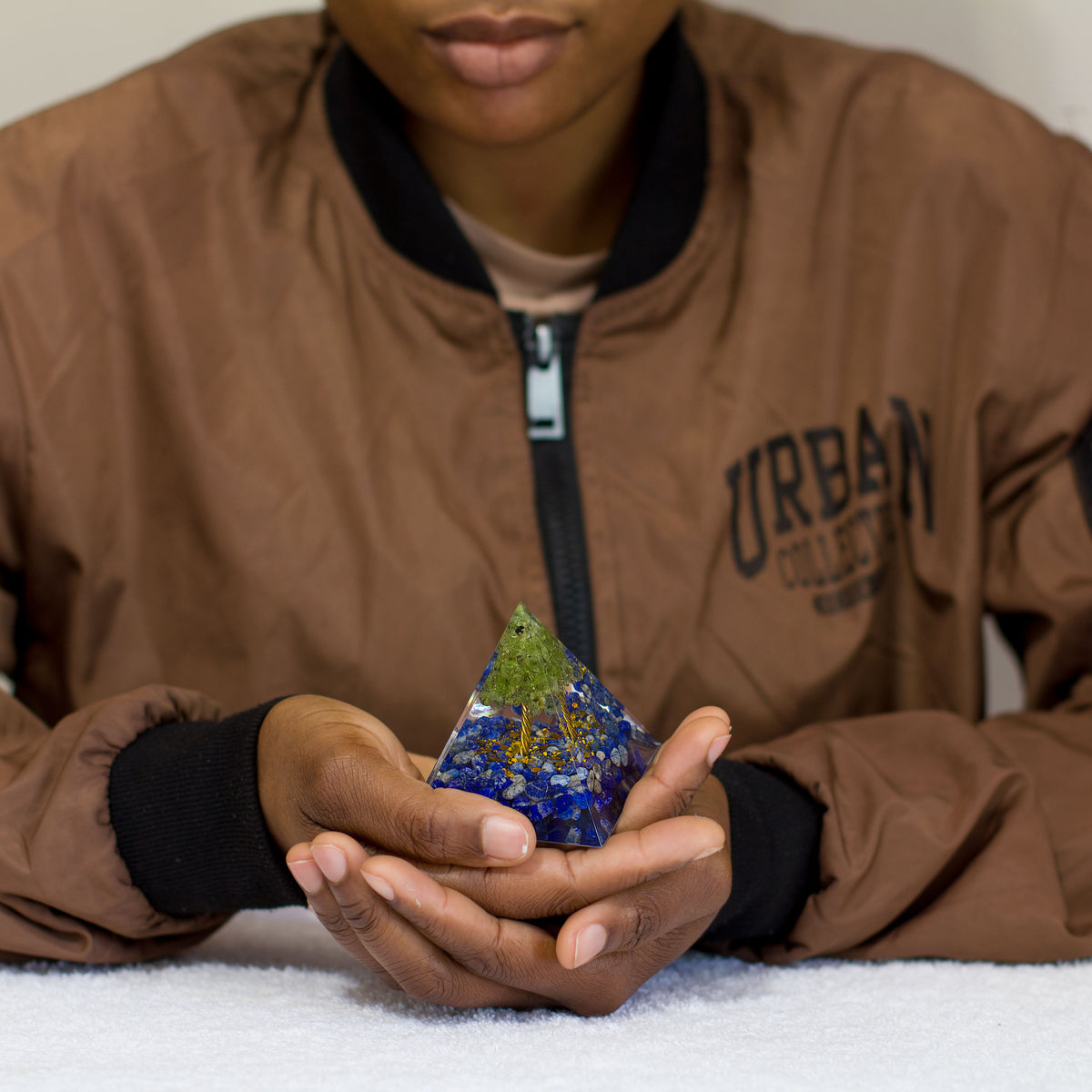 By tapping into the cosmic universal energy with a mix of quartz crystals, semi-precious gemstones, metals, and resin, you can balance out the life energy that surrounds you. Any negative vibes and energy that affect your body and mind can be removed by using an orgonite pyramid in your home. These healing crystals are made of metal shavings, resin, and gemstones, which balance electromagnetic fields and promote positive energy.