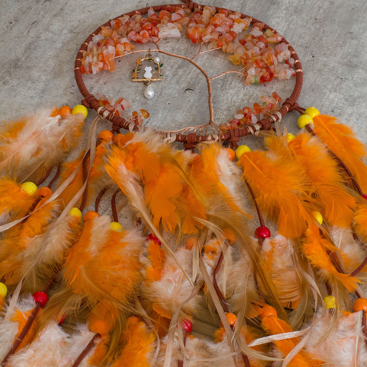 Red-Aventurine-Orange-Dream-catcher - Just the words dream and catcher in one sentence resonates in my soul as a belief that is possible to dream then catch that dream to make it a reality. Weather we day dreaming or night time dreaming the thought of it becoming a reality are far to fascinating to ignore, especially if there is even the slightest truth to the century old beliefs of Native Americans.