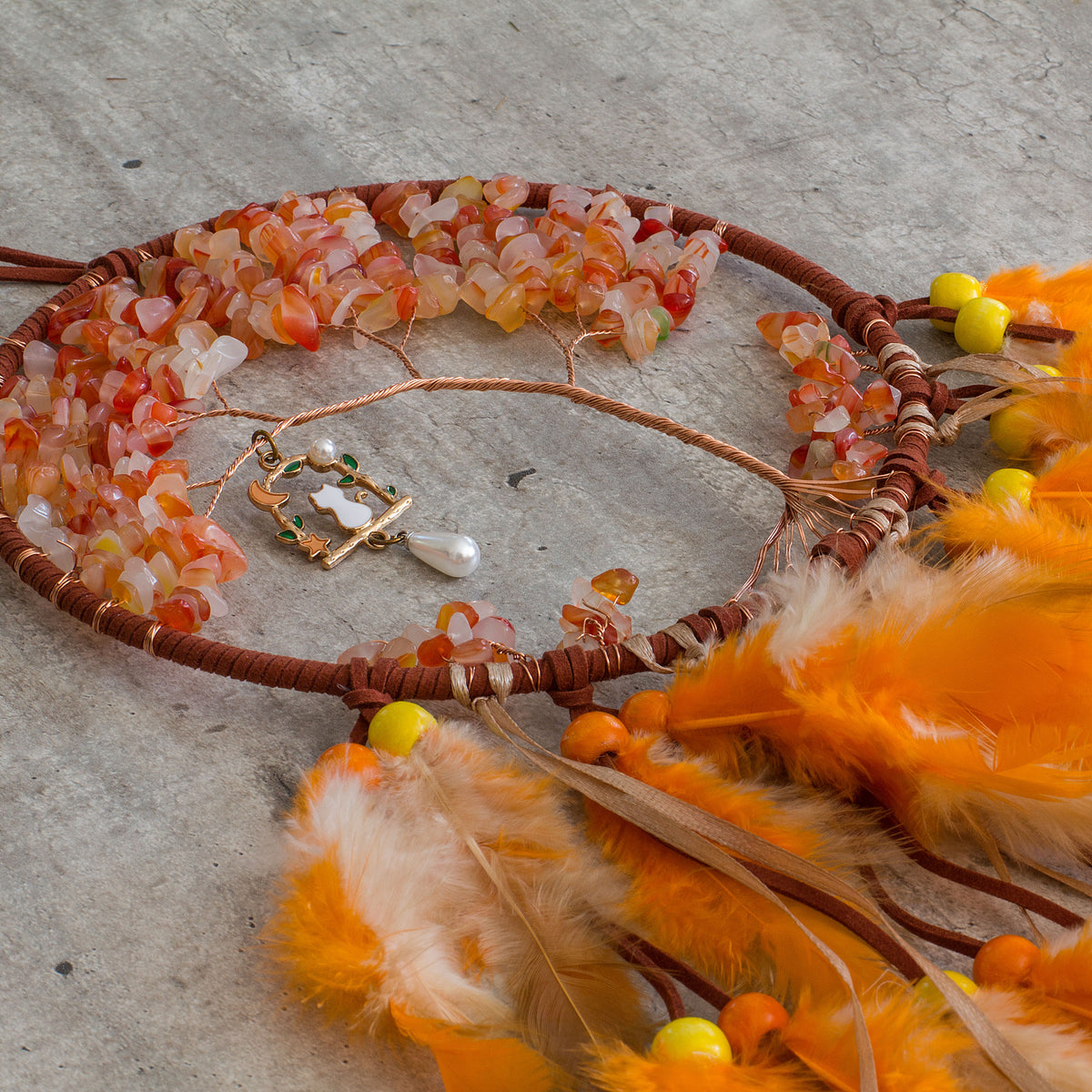 Red-Aventurine-Orange-Dream-catcher - Just the words dream and catcher in one sentence resonates in my soul as a belief that is possible to dream then catch that dream to make it a reality. Weather we day dreaming or night time dreaming the thought of it becoming a reality are far to fascinating to ignore, especially if there is even the slightest truth to the century old beliefs of Native Americans.