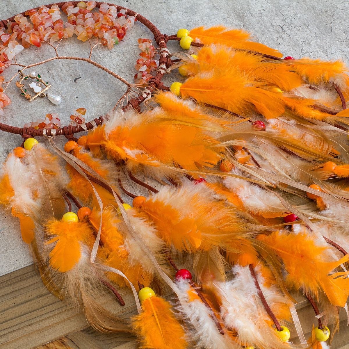 Red-Aventurine-Orange-Dream-catcher - Just the words dream and catcher in one sentence resonates in my soul as a belief that is possible to dream then catch that dream to make it a reality. Weather we day dreaming or night time dreaming the thought of it becoming a reality are far to fascinating to ignore, especially if there is even the slightest truth to the century old beliefs of Native Americans.