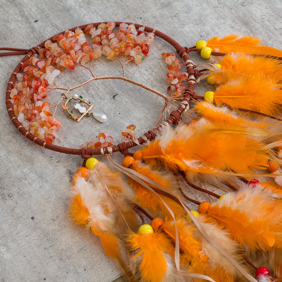 Red-Aventurine-Orange-Dream-catcher - Just the words dream and catcher in one sentence resonates in my soul as a belief that is possible to dream then catch that dream to make it a reality. Weather we day dreaming or night time dreaming the thought of it becoming a reality are far to fascinating to ignore, especially if there is even the slightest truth to the century old beliefs of Native Americans.