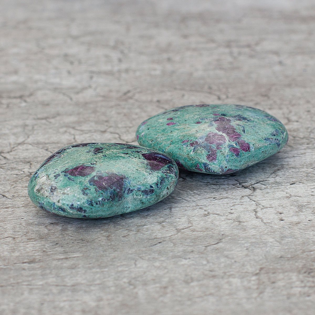 Ruby Fuchsite is a crystal that combines the energies of two stones: Ruby and Fuchsite. This crystal is known for creating a resonance greater than the sum of its parts, symbolizing harmony, togetherness, and a deep connection. Primarily associated with the Heart Chakra, Ruby Fuchsite is considered an excellent choice for love, fertility, and overall well-being. The contrasting hues and densities of Ruby and Fuchsite are seen as a sign of harmony.