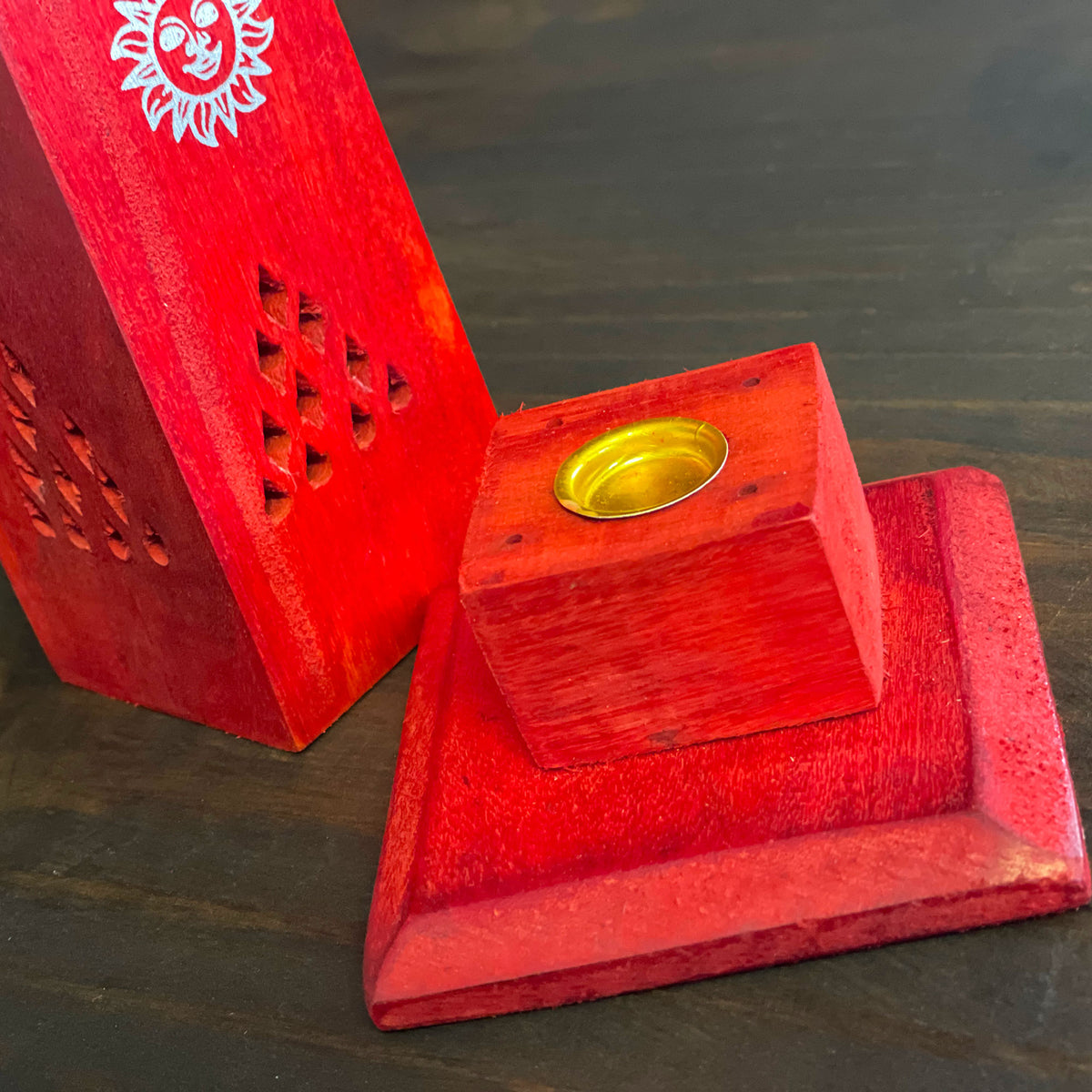 A multipurpose Stylish wooden holder to place an incense cone or Stick into. Simply remove the gold plate to insert an incense stick in the middle or place an incense cone on the plate in the center. Watch as the smoke escapes through the holes of this Stunning Tower Holder.