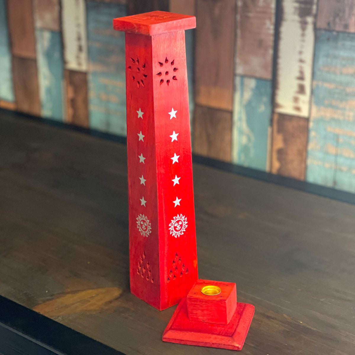 A multipurpose Stylish wooden holder to place an incense cone or Stick into. Simply remove the gold plate to insert an incense stick in the middle or place an incense cone on the plate in the center. Watch as the smoke escapes through the holes of this Stunning Tower Holder.